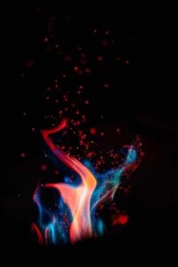Black background, blue, orange, and red flame in front