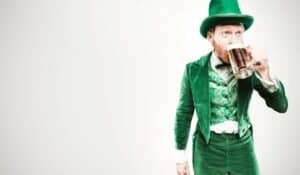 person dressed in green drinking beer