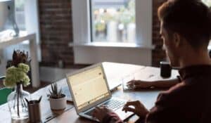 man working on computer at home