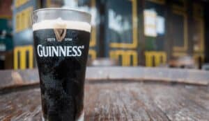 glass of guinness beer on a wooden table