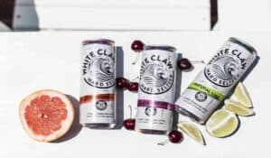 white claws surrounded by fruit