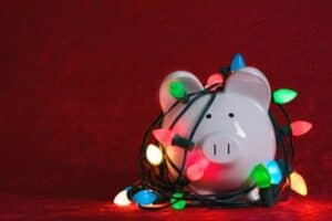 piggy bank wrapped in Christmas lights