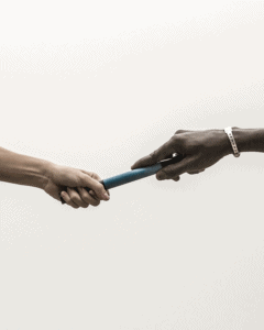 Two hands holding onto the ends of a baton